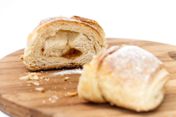 Piece of puff pastry on the wooden board