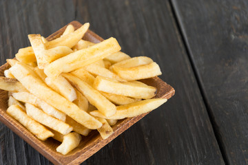 french fries on wood background