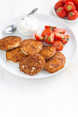 Pancakes with fresh strawberries and cream. 