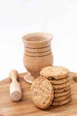 Wooden mortar and integral cookies on the wooden board
