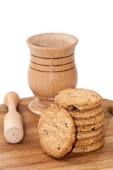 Wooden mortar and integral cookies on the wooden board