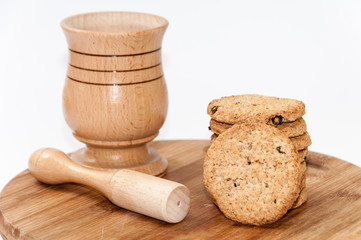 Wooden mortar and integral cookies on the wooden board