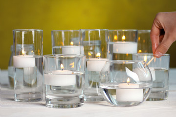 Fototapeta na wymiar candles on white wooden table