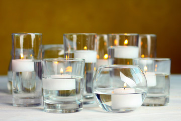 candles on white wooden table