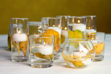 candles on white wooden table