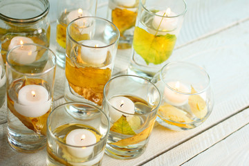 candles on white wooden table