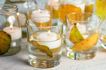 candles on white wooden table