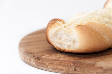 Pastry stuffed with cheese on the wooden board