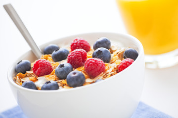 Healthy breakfast with muesli, fresh fruit and orange juice