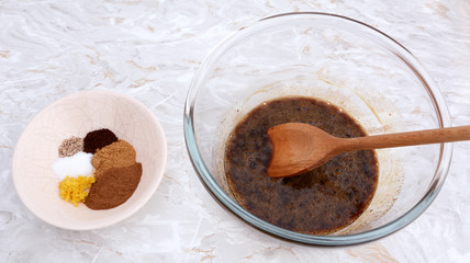 Ingredients for pumpkin pie - spices with egg and sugar filling