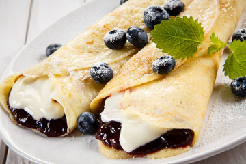 Crepes with blueberries and cream