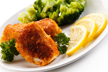 Fish dish - fried fish fillets and vegetables 