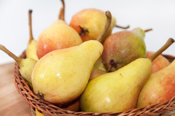 Fresh pears in the wooden basket