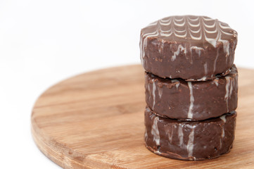 Pile of chocolate muffins on the wooden board