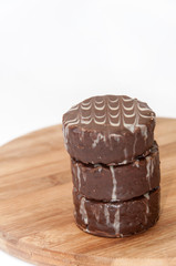 Pile of chocolate muffins on the wooden board