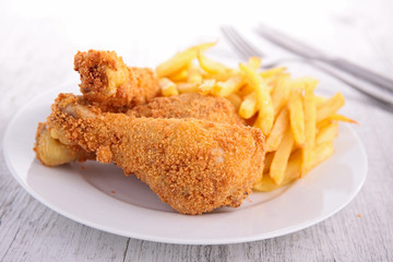 fried chicken leg and french fries