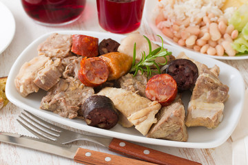 typical portuguese dish cozido a portuguesa and red wine