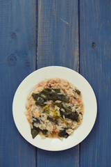 greens with smoked portuguese sausage and rice on plate