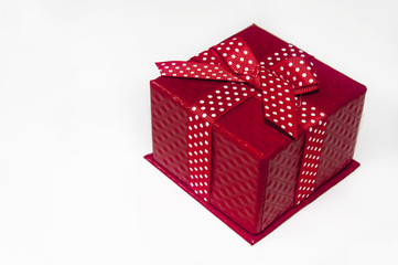 Closed beautiful red box with bow