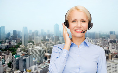 helpline operator in headset over city background