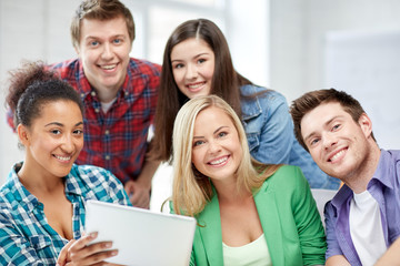group of happy high school students with tablet pc