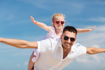 happy family having fun over blue sky background