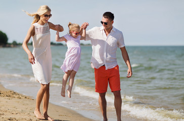 happy family in sunglasses on summer beach