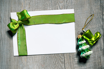 Holidays gift card with green bow