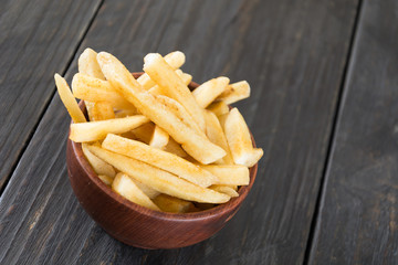 french fries on wood background
