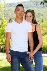 Mixed young couple in a park