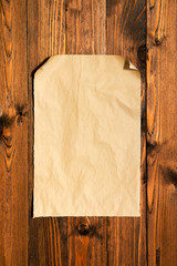 Blank paper on old wooden wall background for put your text.