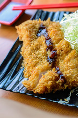 Tonkatsu deep fried pork cutlet serve with slice cabbage