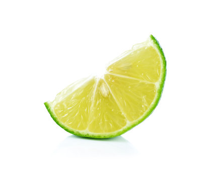 Limes with slices on white background