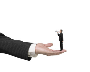 Small businessman using speaker shouting on big male hand