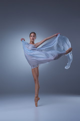 The beautiful ballerina dancing with blue veil