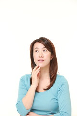 Fototapeta premium young Japanese woman thinks about something