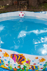 Fototapeta na wymiar Kids ball in the pool with wather in it