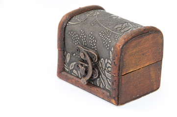 Closed wooden chest over white background