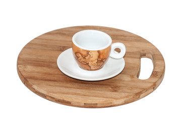 Pair of beautiful coffee mugs on the wooden board