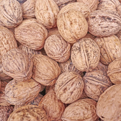 organic walnuts close up, vegan food background