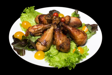Photo of chicken thighs in honey sauce on a lettuce leaf