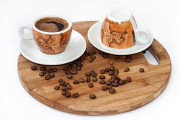 Cup of coffee on the wooden board