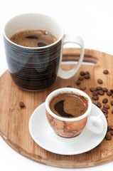 Cup of coffee on the wooden board