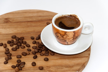 Cup of coffee on the wooden board