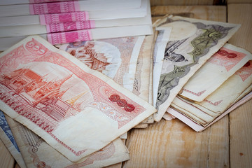 Thai Baht money on the wood floor