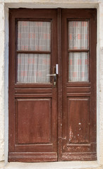 old brown yellow ragged shabby wooden door