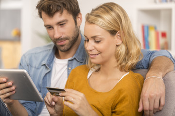 young couple buying on internet