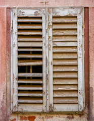 Fototapeta na wymiar window with closed wooden shutters
