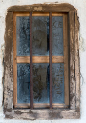old window with metal bars
