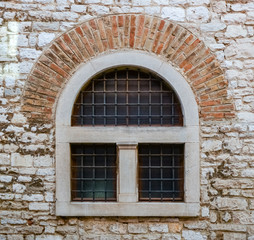 old window with metal bars 
